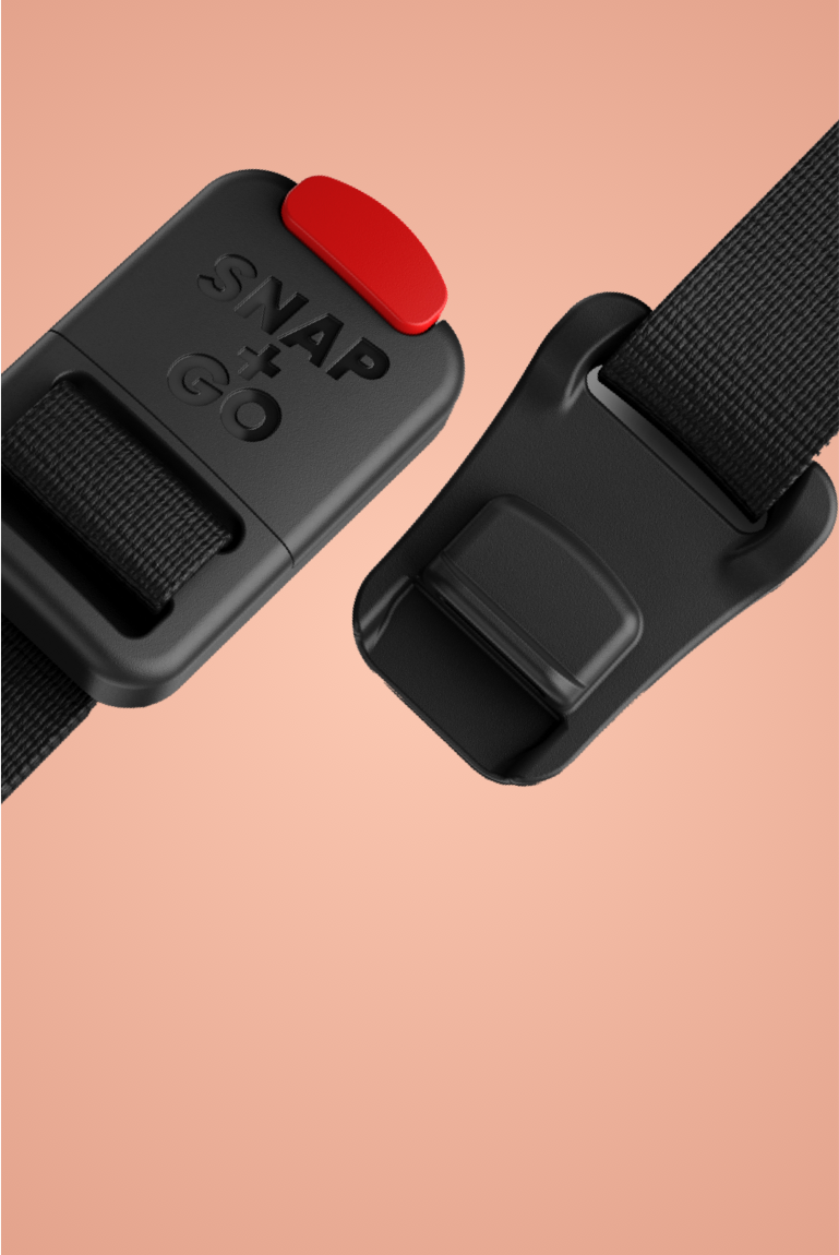 "        
Close-up of the magnetic buckle on the READY Kids' Helmet by woom, viewed on a colored background"